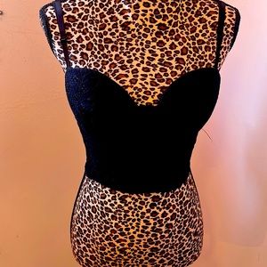 Black bustiers crop top with zipper and back and adjustable spaghetti straps.